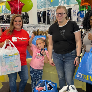 Pay Away volunteers surprise mom and daughter with paid off layaway items.